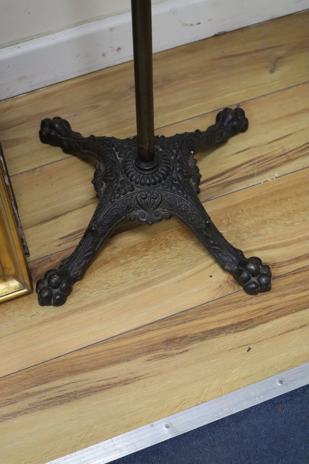 A late Victorian brass and cast iron adjustable lectern, with an oak reading slope, height 124cm